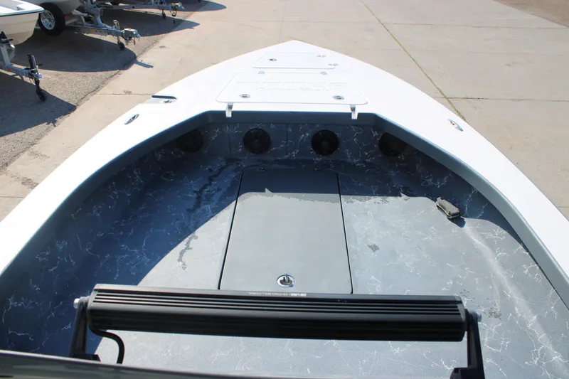 Slide: The Image of 2023 Mamba 24VX boat interior with sleek design and storage compartments. - 8