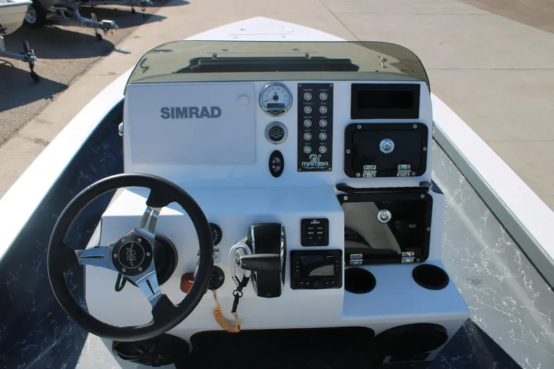 Slide: The Image of 2023 Mamba 24VX boat console with Simrad electronics and steering wheel. - 9