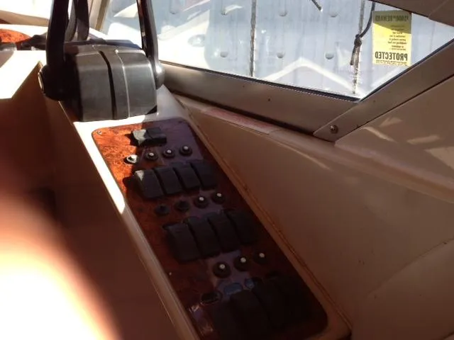 Slide: The Image of Dashboard of a 1995 Regal Commodore 322 boat with switches. - 10