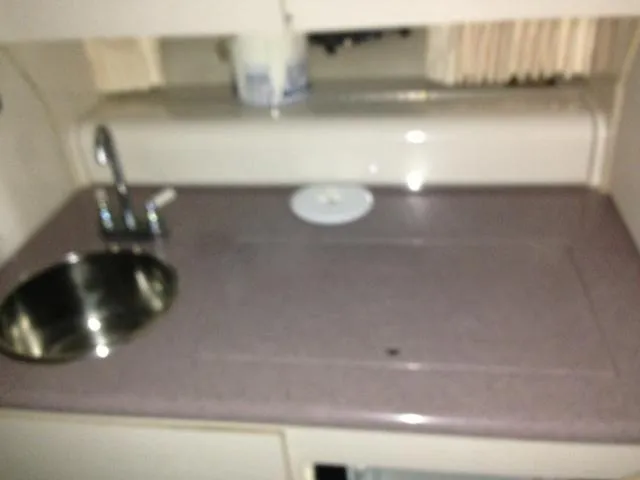 Slide: The Image of Galley area in 1995 Regal Commodore 322 boat. - 14