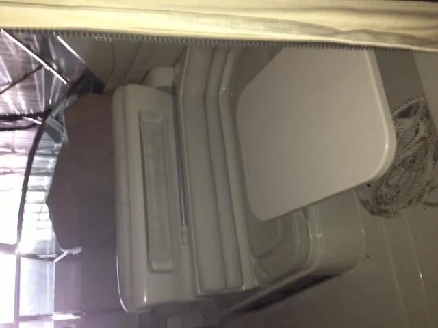Slide: The Image of Interior of a 1995 Regal Commodore 322 boat with seating area. - 16