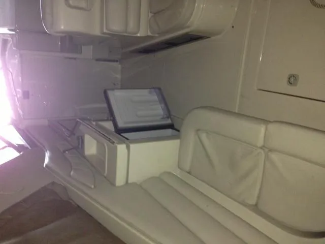 Slide: The Image of Interior of a 1995 Regal Commodore 322 boat with seating area. - 17