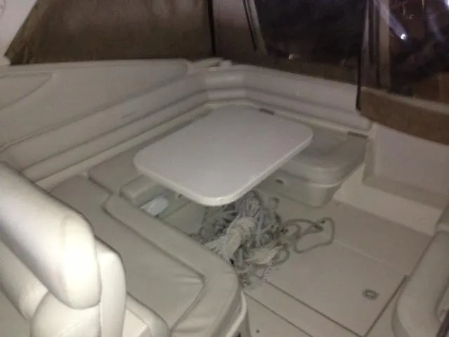 Slide: The Image of Interior of 1995 Regal Commodore 322 with seating area and table. - 18