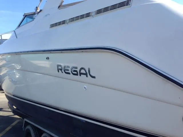Slide: The Image of 1995 Regal Commodore 322 boat, side view with logo. - 3