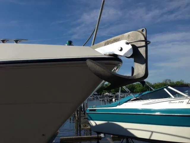 Slide: The Image of Bow of a 1995 Regal Commodore 322 boat at the dock. - 4