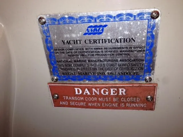 Slide: The Image of Yacht certification plaque and warning on Regal Commodore 322, year 1995. - 9