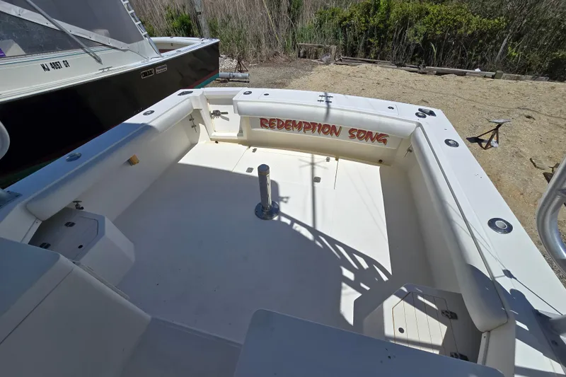Slide: The Image of 2003 Albemarle 305 Express Fisherman boat deck with "Redemption Song" text. - 10
