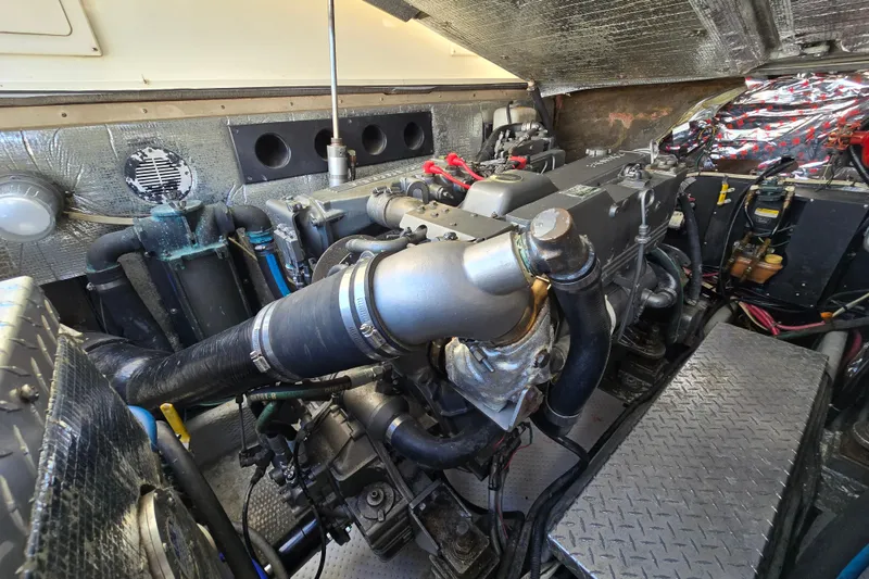 Slide: The Image of Engine room of a 2003 Albemarle 305 Express Fisherman boat, showcasing detailed machinery. - 26