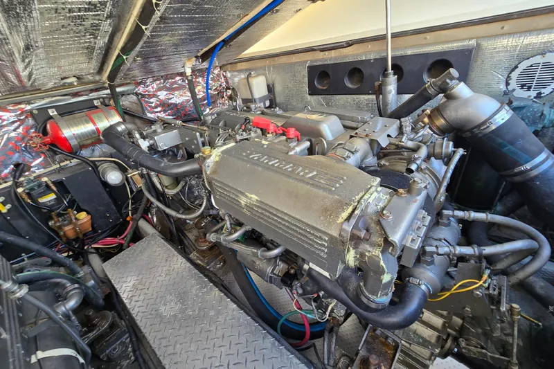 Slide: The Image of Engine room of 2003 Albemarle 305 Express Fisherman boat, showcasing detailed machinery and components. - 27