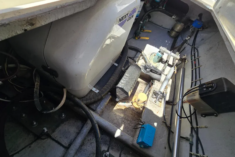 Slide: The Image of Engine compartment of a 2003 Albemarle 305 Express Fisherman boat, showing mechanical components. - 28