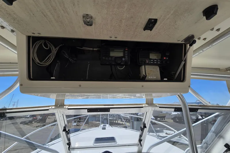 Slide: The Image of 2003 Albemarle 305 Express Fisherman boat dashboard with electronic equipment and wiring. - 5