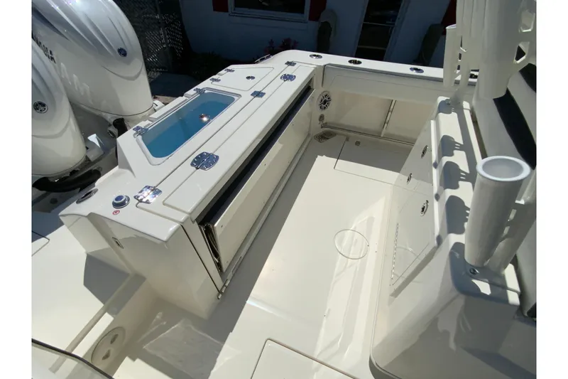 Slide: The Image of 2026 Cobia 245 Center Console boat interior with storage and seating. - 13