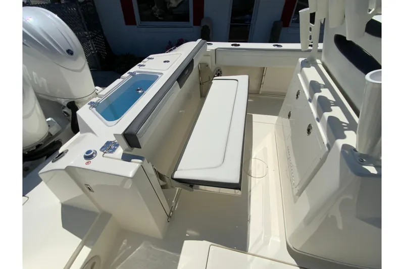 Slide: The Image of 2026 Cobia 245 Center Console boat interior with seating and storage features. - 14