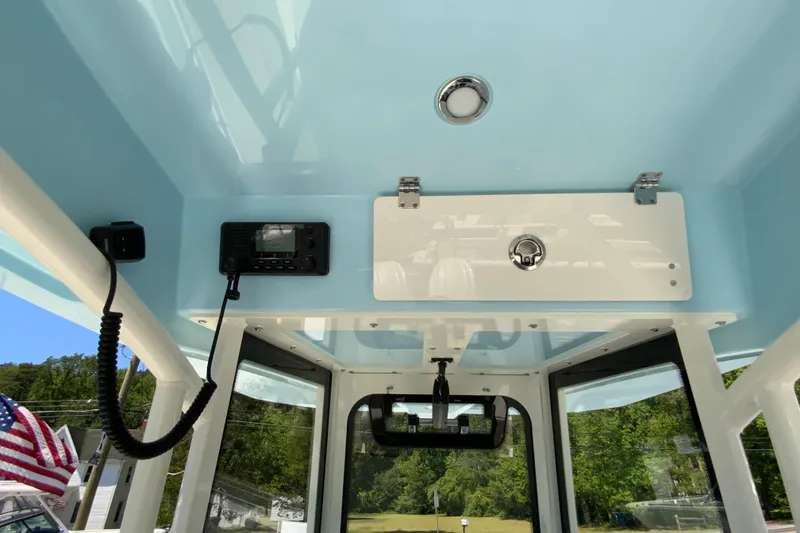 Slide: The Image of Interior view of 2026 Cobia 245 Center Console boat with communication equipment. - 23