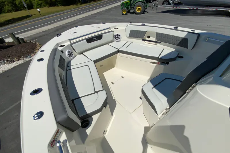 Slide: The Image of 2026 Cobia 245 Center Console boat interior with cushioned seating and modern design. - 28