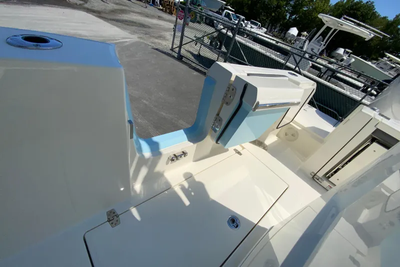 Slide: The Image of 2026 Cobia 245 Center Console boat interior with seating and storage compartments. - 41