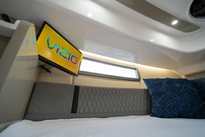 Slide: The Image of Luxurious interior of 2027 Hanover 387 yacht with Vizio TV and plush bedding. - 1