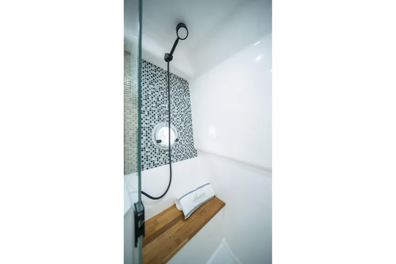 Slide: The Image of Modern shower with mosaic tiles and wooden bench in Hanover 387, 2027 model. - 10