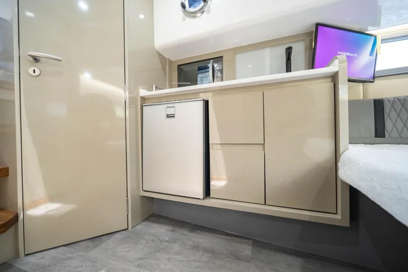 Slide: The Image of Modern interior of Hanover 387, 2027 model, featuring sleek cabinetry and compact design. - 5