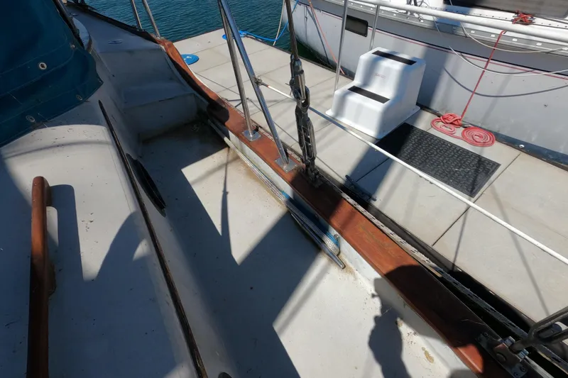 Slide: The Image of Deck of a 1978 CSY 44 sailboat with ropes and steps. - 36
