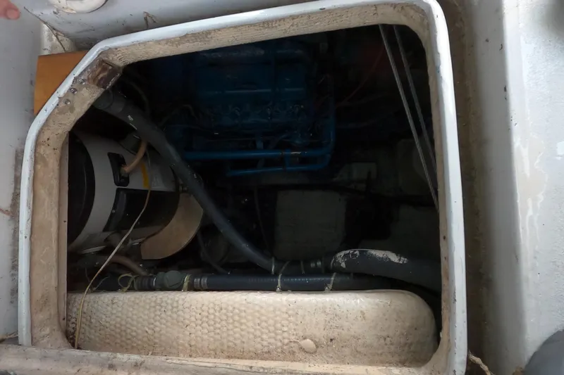 Slide: The Image of Engine compartment of a 1978 CSY 44 sailboat, showing mechanical components and wiring. - 39