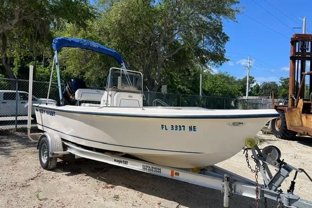 The Image of 2006 Key West 1720 Center Console boat on trailer, parked outdoors. - 1