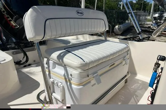 Slide: The Image of 2006 Key West 1720 Center Console boat interior with cushioned seating and storage. - 6