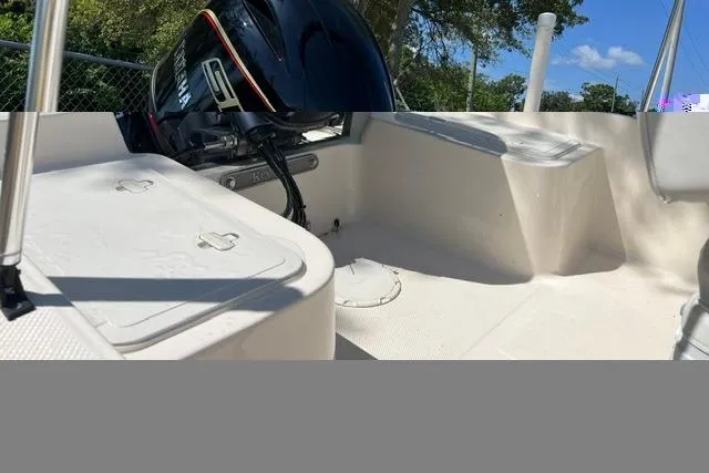 Slide: The Image of 2006 Key West 1720 Center Console boat interior with Yamaha engine, white deck, and seating. - 8
