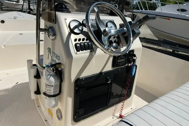 Slide: The Image of 2006 Key West 1720 Center Console boat interior with steering wheel and controls. - 9
