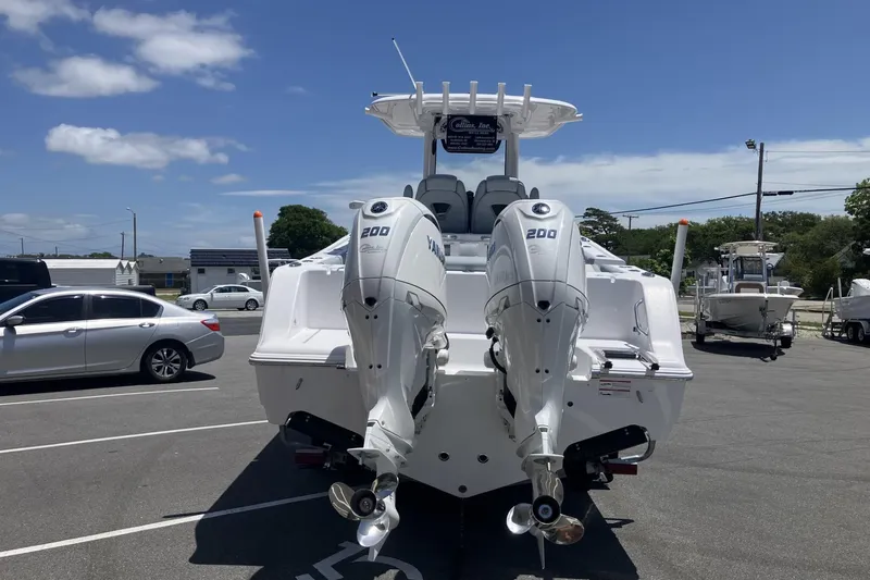 Slide: The Image of 2026 Sportsman Open 262 Center Console with twin 200 horsepower engines in a parking lot. - 3