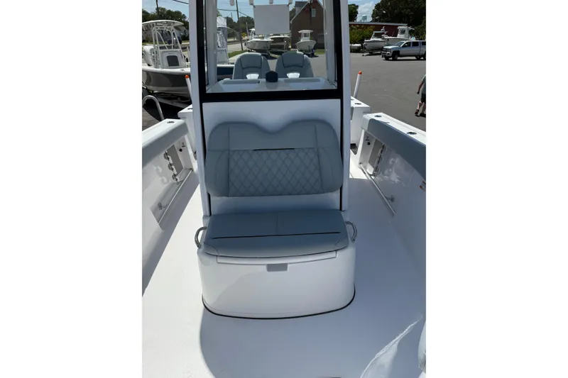 Slide: The Image of 2026 Sportsman Open 262 Center Console boat with cushioned seating and sleek design. - 6