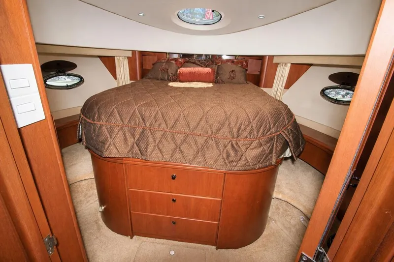 Slide: The Image of Luxurious cabin interior of 2006 Silverton 38 Sport Bridge yacht with elegant bedding. - 14