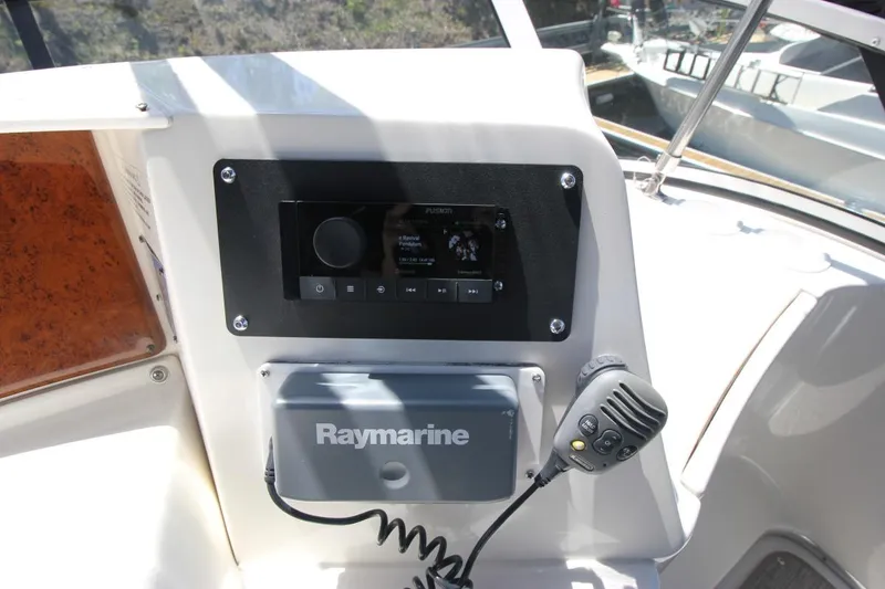 Slide: The Image of Control panel of a 2006 Silverton 38 Sport Bridge with Raymarine equipment. - 22