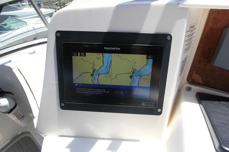 Slide: The Image of Raymarine navigation display on 2006 Silverton 38 Sport Bridge yacht dashboard. - 23