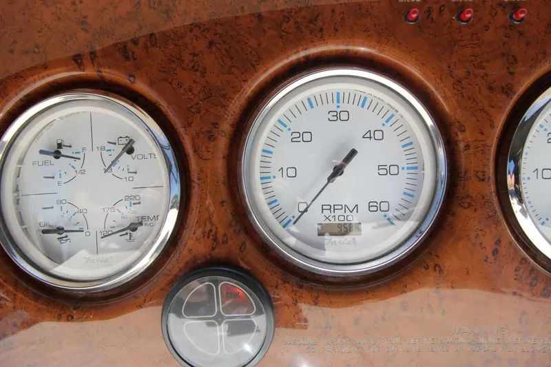 Slide: The Image of Dashboard gauges of a 2006 Silverton 38 Sport Bridge boat, featuring RPM and fuel indicators. - 27