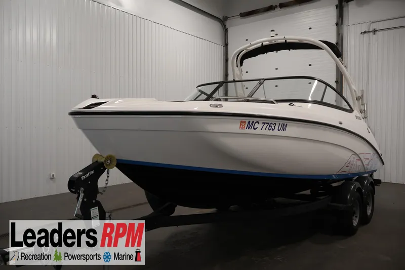 The Image of 2021 Yamaha AR210 boat on trailer in indoor showroom. - 1