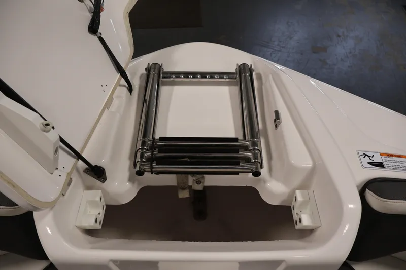 Slide: The Image of 2021 Yamaha AR210 boat ladder and storage compartment detail. - 13