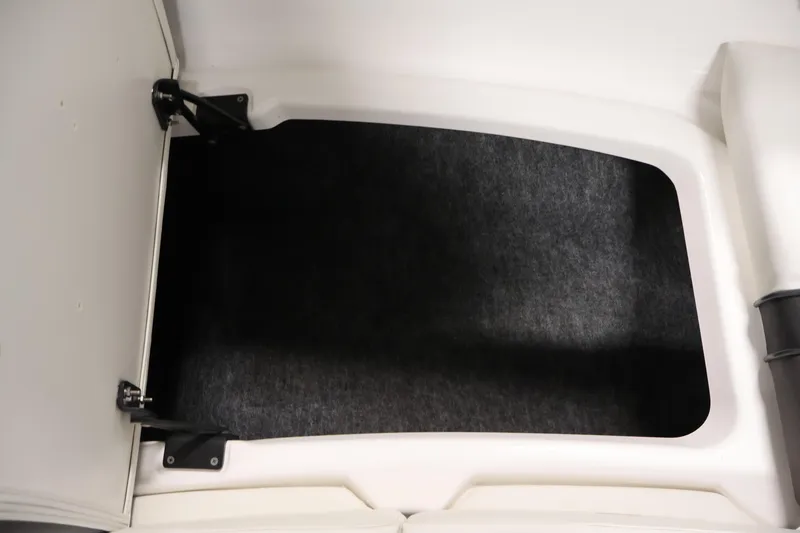 Slide: The Image of 2021 Yamaha AR210 boat storage compartment with open hatch. - 15