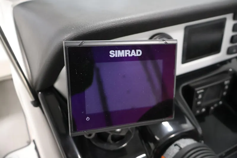 Slide: The Image of Simrad display on 2021 Yamaha Boats AR210 dashboard, showcasing modern navigation technology. - 23