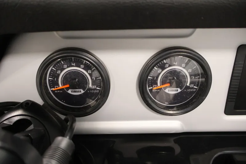 Slide: The Image of Dashboard of 2021 Yamaha AR210 boat showing dual RPM gauges. - 24
