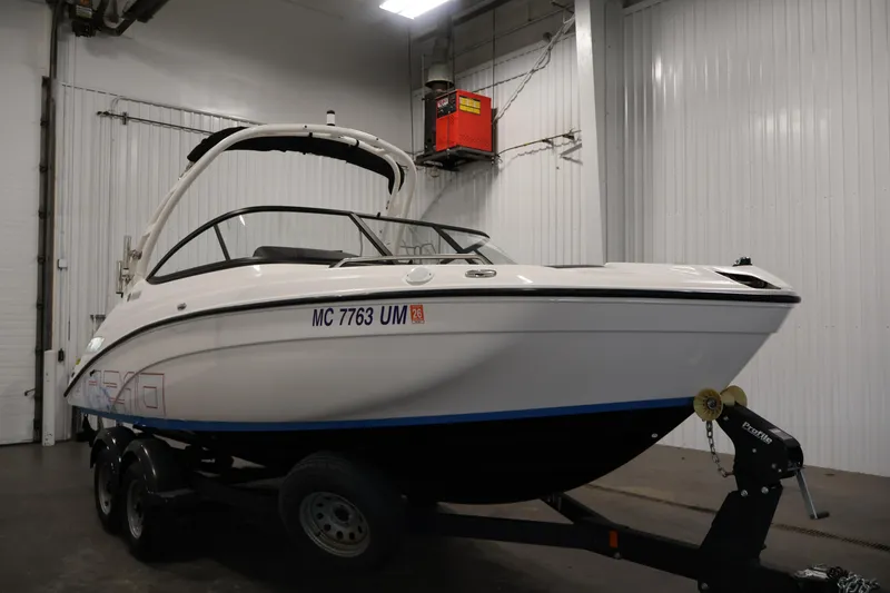 Slide: The Image of 2021 Yamaha Boats AR210 on trailer in indoor storage facility. - 3
