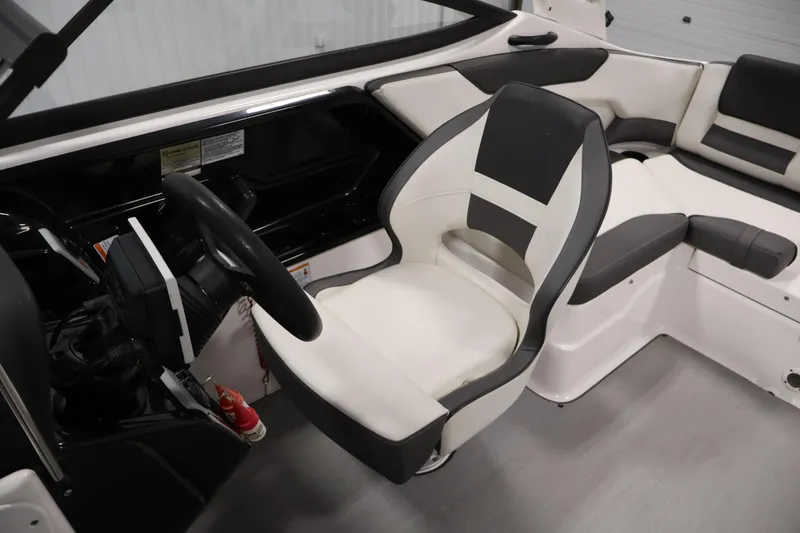 Slide: The Image of 2021 Yamaha Boats AR210 interior with sleek steering and comfortable seating. - 30