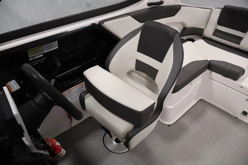 Slide: The Image of 2021 Yamaha Boats AR210 interior with steering wheel and comfortable seating. - 31
