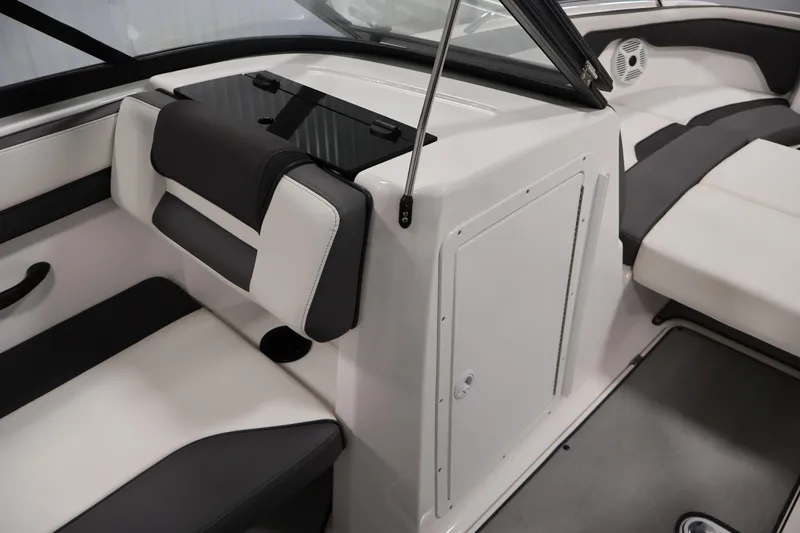 Slide: The Image of 2021 Yamaha AR210 boat interior with sleek seating and storage compartment. - 32