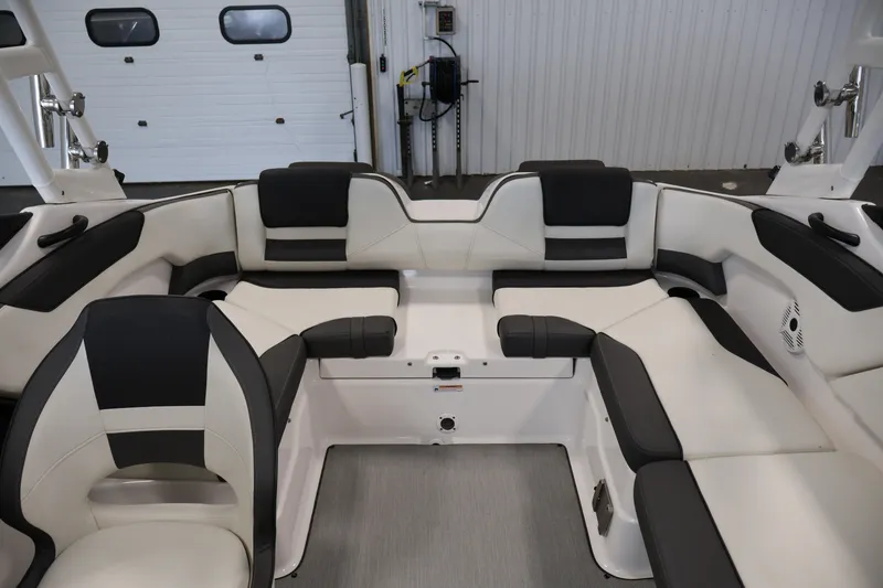 Slide: The Image of Interior of 2021 Yamaha AR210 boat with sleek black and white seating. - 37
