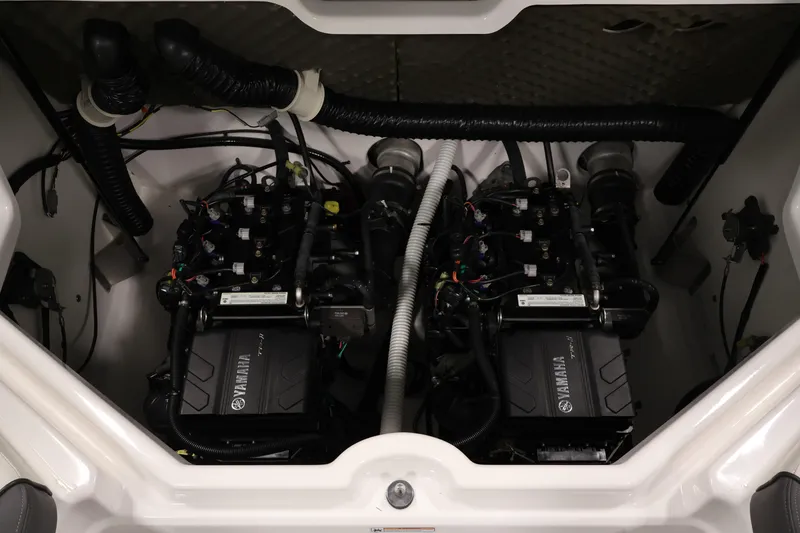 Slide: The Image of Engine compartment of a 2021 Yamaha Boats AR210, showcasing dual engines and wiring. - 39