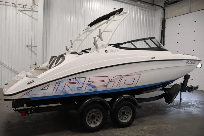 Slide: The Image of 2021 Yamaha Boats AR210 on trailer in indoor storage facility. - 4
