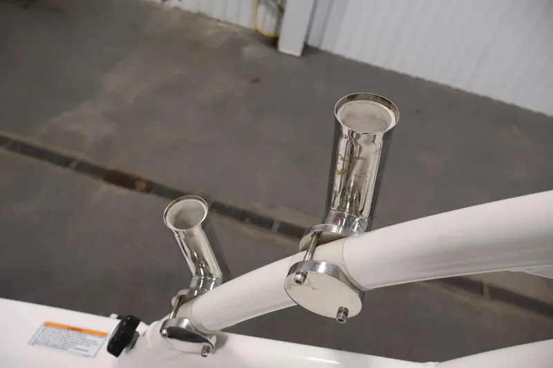 Slide: The Image of Rod holders on a 2021 Yamaha Boats AR210, showcasing stainless steel construction. - 41