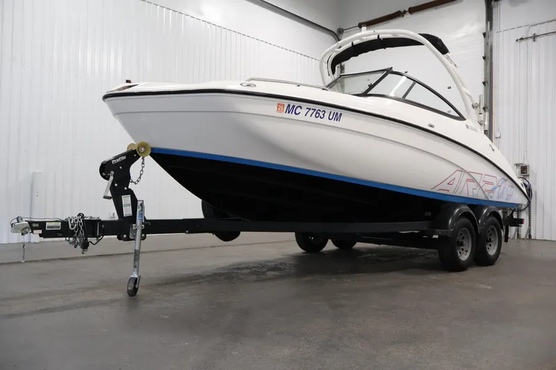Slide: The Image of 2021 Yamaha Boats AR210 on trailer in indoor storage facility. - 47
