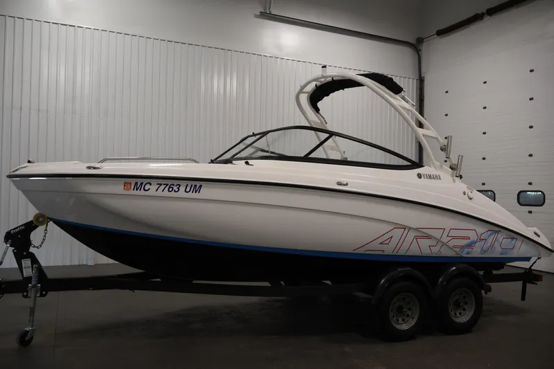 Slide: The Image of 2021 Yamaha Boats AR210 on trailer in indoor storage facility. - 8